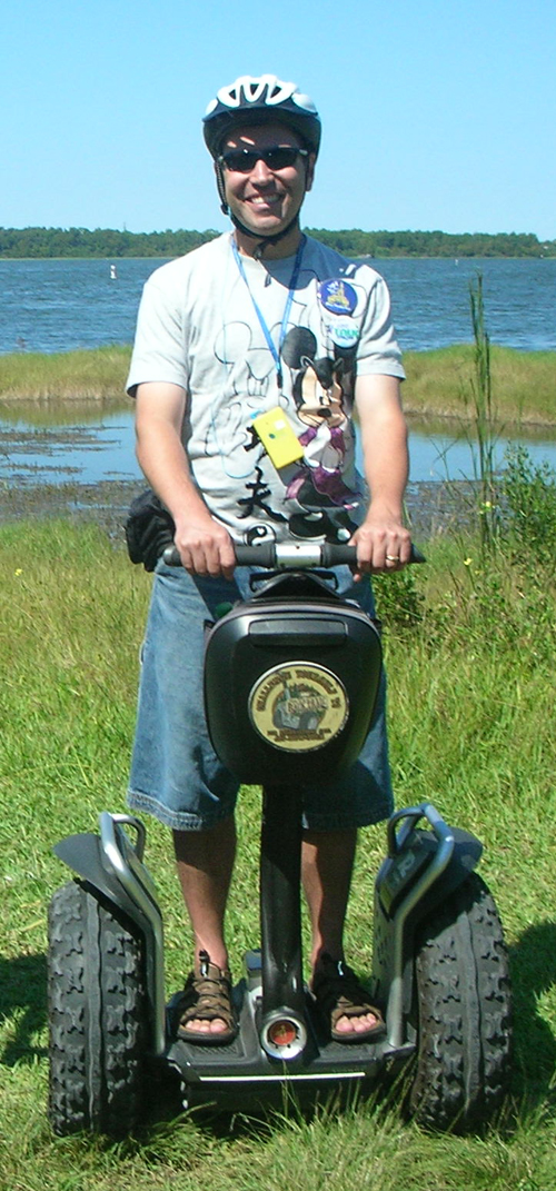 The Mouse Planner rides a Segway at Disney's Fort Wilderness